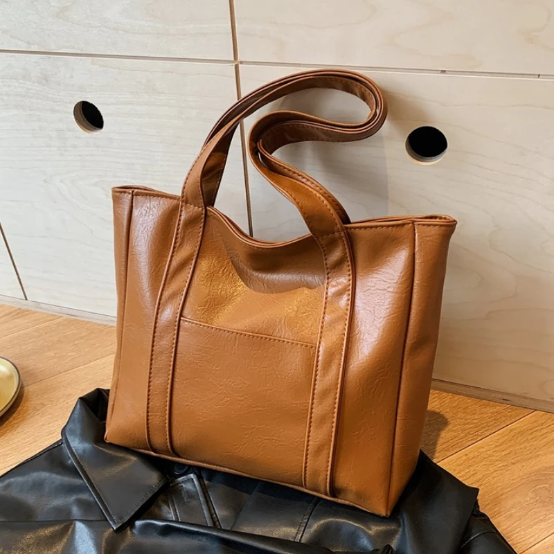 S47a3c92794d6479fb03388d095572822E.webp Simple Large Capacity Tote Bags for Women Retro Pu Leather Ladies Shoulder Bag Commuter Portable Girls Student Underarm Handbag - Image 1